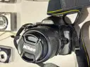 Lot of various cameras, consumer electronics, networking routers, photography equipment