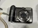 Lot of various cameras, consumer electronics, networking routers, photography equipment