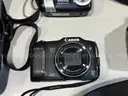 Lot of various cameras, consumer electronics, networking routers, photography equipment