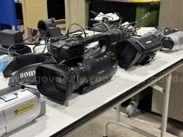 Four video cameras and assorted cables