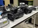 Four video cameras and assorted cables