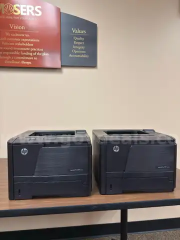 2x HP LaserJet Pro 400 printers, working, with the power cord and cartridge.