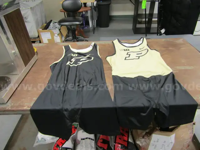 1 Box of Old Purdue Track Singlets
