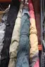 (4) Rolled Fabric Rugs and (1) Assortment of Rods &#x2013; Multi-Color