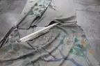 (4) Rolled Fabric Rugs and (1) Assortment of Rods &#x2013; Multi-Color