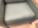 Padded reclining chair on wheels