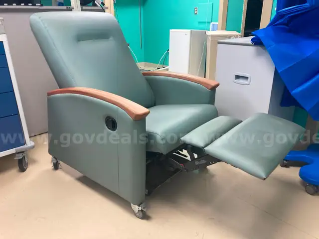 Padded reclining chair on wheels