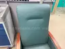 Padded reclining chair on wheels