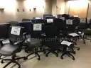 Lot of 26 rolling office chairs and 2 stools