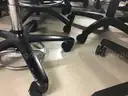 Lot of 26 rolling office chairs and 2 stools