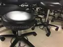 Lot of 26 rolling office chairs and 2 stools