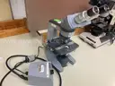 Lot of 9 microscopes and 1 Pentax camera with eyepieces attached