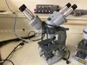 Lot of 9 microscopes and 1 Pentax camera with eyepieces attached