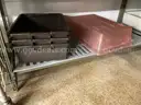 Lot of cafeteria trays, pans, plastic dishwasher trays, small plates