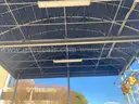 Large carport - approx 16x24ft - with light fixtures and 2 electrical cord reels