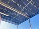 Large carport - approx 16x24ft - with light fixtures and 2 electrical cord reels