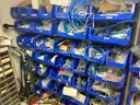 Spare parts for repair of medical equip - includes metal shelves with plastic bins