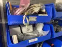 Spare parts for repair of medical equip - includes metal shelves with plastic bins