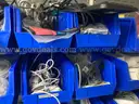 Spare parts for repair of medical equip - includes metal shelves with plastic bins