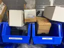 Spare parts for repair of medical equip - includes metal shelves with plastic bins