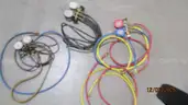 Air conditioning gauges and vacuum pump