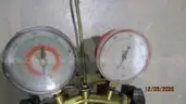 Air conditioning gauges and vacuum pump