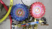 Air conditioning gauges and vacuum pump