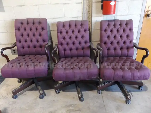 3 WOODEN ROLLING DESK CHAIRS WITH ROSE MAUVE FABRIC COVERING