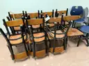 FIFTEEN BLACK AND WOOD CHAIRS