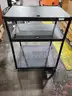 Black steel multipurpose cart with swivel wheels