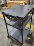 Black steel multipurpose cart with swivel wheels