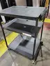 Black steel multipurpose cart with swivel wheels