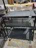 Black steel multipurpose cart with swivel wheels