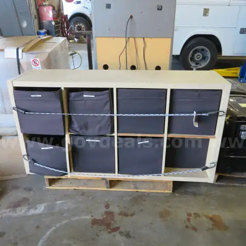 Storage cabinet with 8 cubby holes, has fabric flexible totes.
