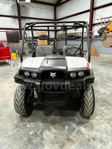 UTV with manual dump bed.