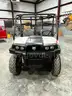 UTV with manual dump bed.