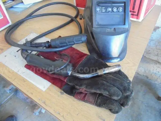 Lot of Welding Gloves, Lead, Helmet, Box, Oiler Bottle and Fence Gloves.