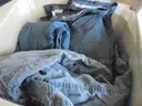 Lot of (7) BDU Pants, (4) BDU Shirts, (6) Raincoats, and (21) Stocking Hats