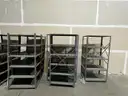 Lot of (14) Metal Shelving in Various Sizes and Styles.