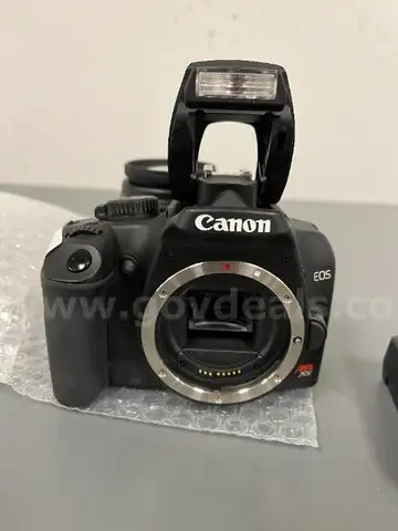Canon EOS Rebel XS 10.1MP DSLR Camera with Accessories.