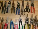 Lot of 44 Various Linesman Pliers and Metal Cutting Tools.