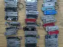 Lot of 100 Small Leatherman Multi-tools.
