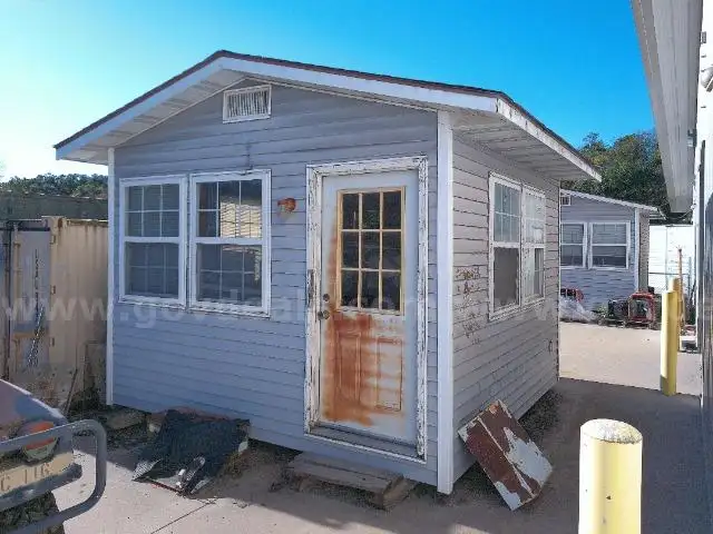 Lot of a Portable Office Building, Misc. Office Furniture, and an AC Unit.
