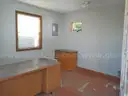 Lot of a Portable Office Building, Misc. Office Furniture, and an AC Unit.