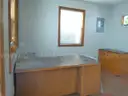 Lot of a Portable Office Building, Misc. Office Furniture, and an AC Unit.