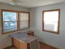 Lot of a Portable Office Building, Misc. Office Furniture, and an AC Unit.