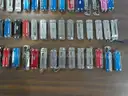Lot of (100) Small Leatherman Multi-tools.