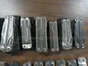 Lot of 29 Large Leatherman Multi-tools and 7 Small Leatherman Multi-tools.