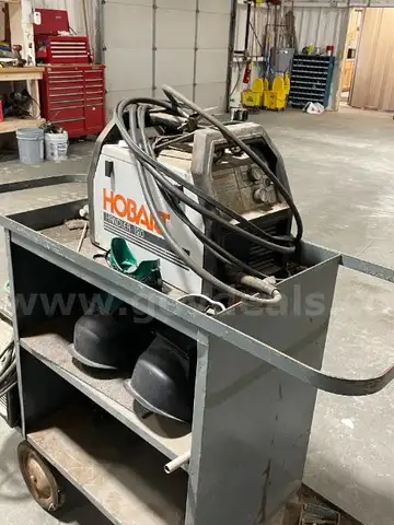 Lot of 2 Welding Machines, Helmets and Metal Cart.