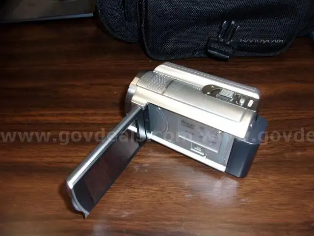 Lot of (2) Microphone Systems and (2) Handycam Camcorders.